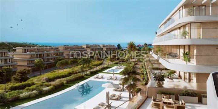 Can I buy property and live in Spain?