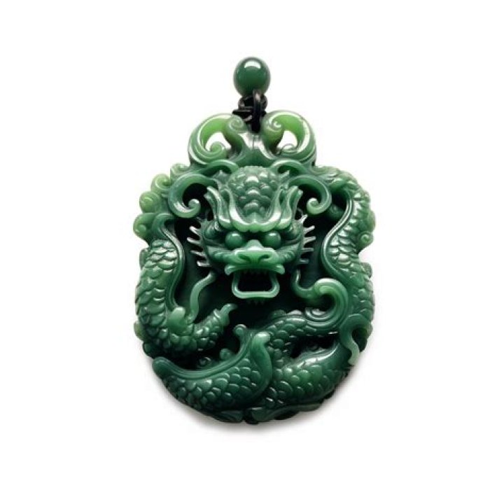 What does a jade dragon pendant symbolize?
