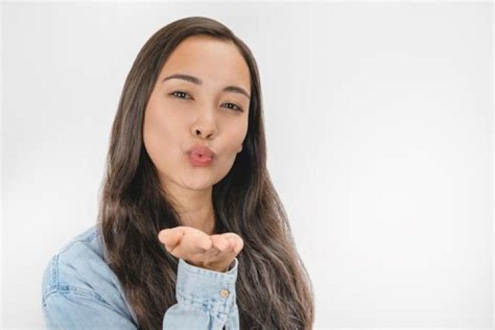 What does it mean when a girl blows you a kiss?