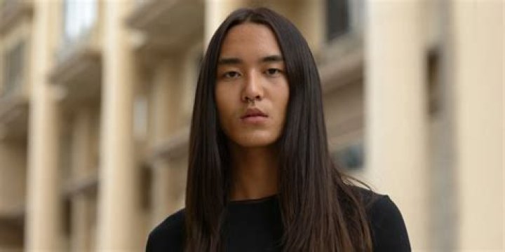 What does long hair on a man symbolize?
