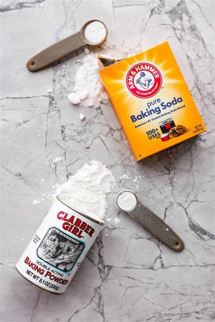 What is the purpose of adding baking soda to soapy water when washing dishes?