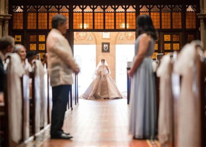 Who usually walks the brides mother down the aisle?