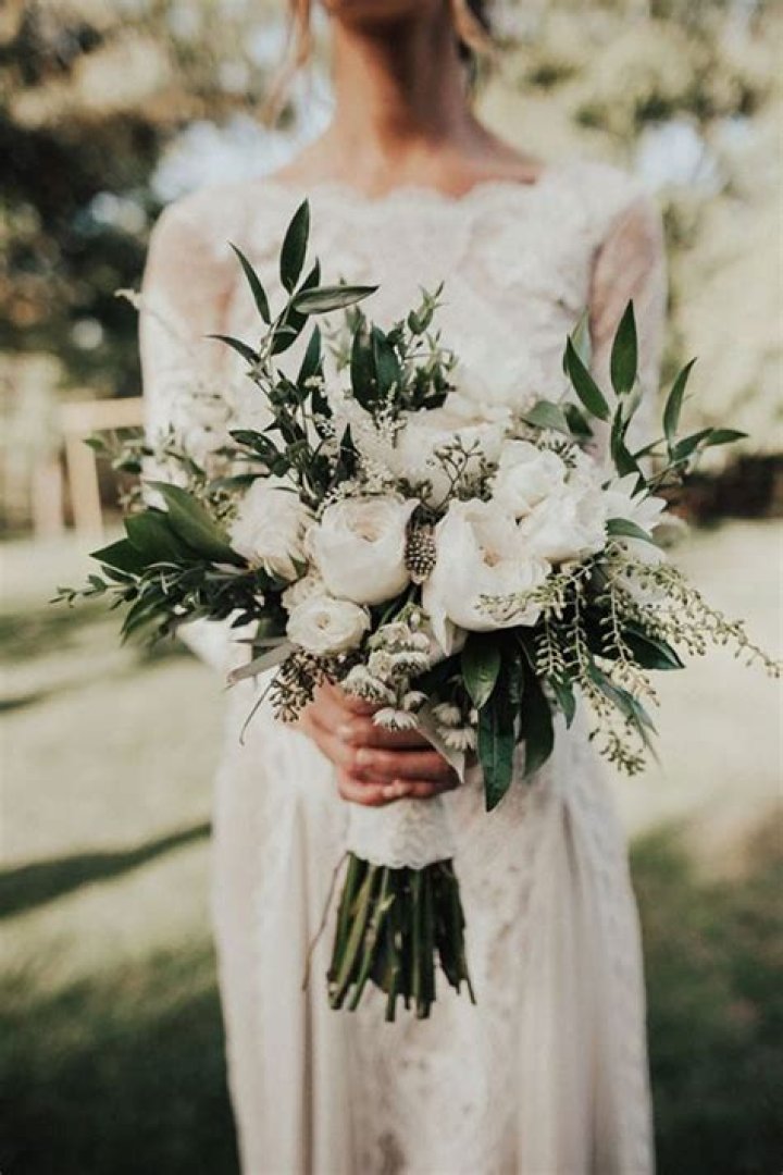 Why do brides carry a bouquet?