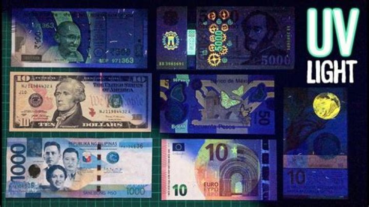 Why do some dollar bills glow under black light?